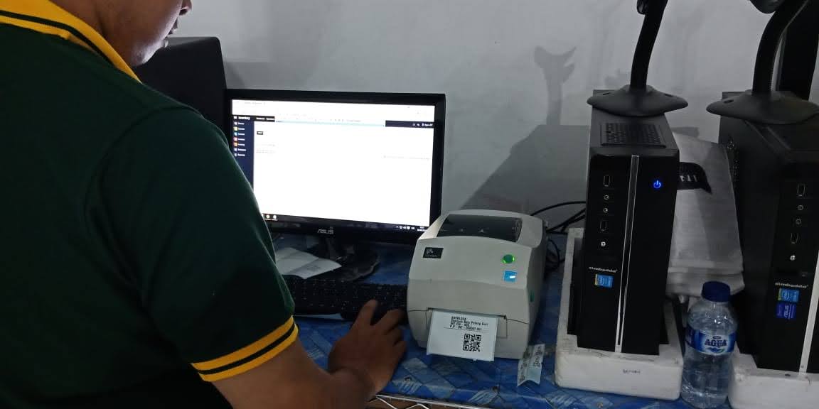 A label printer producing SherlockTools product barcodes next to a warehouse computer